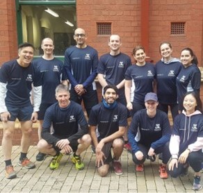 A picture of the Running Club at The University of Melbourne. A group of runners are pictured smiling at the camera.